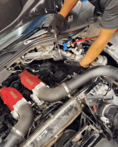 Close-up of Ferrari California T engine during service in Dubai workshop