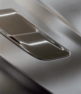 Detailed view of peelable paint being carefully applied to a Ford Mustang at The Car Lab Auto Repair Center