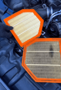 Expert technicians handling the major service of a BMW M6