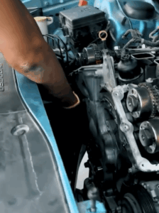 Mechanic diagnosing engine issues of a Dodge Charger
