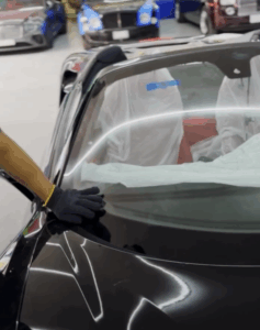 Precision windscreen installation for Ferrari 488 GTB at The Car Lab Auto Repair Center