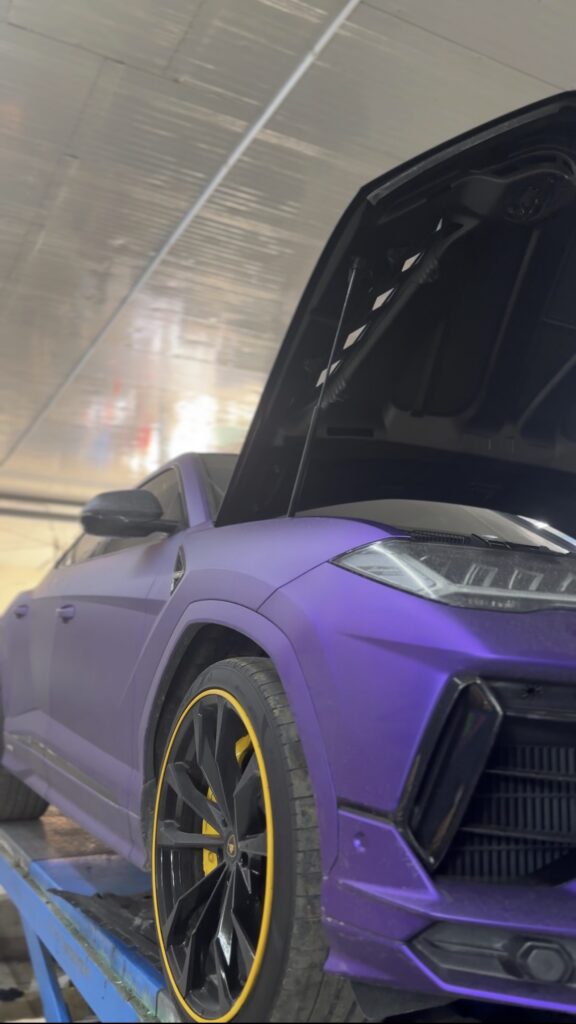 Front view of Lamborghini Urus during engine oil service and inspection in Dubai