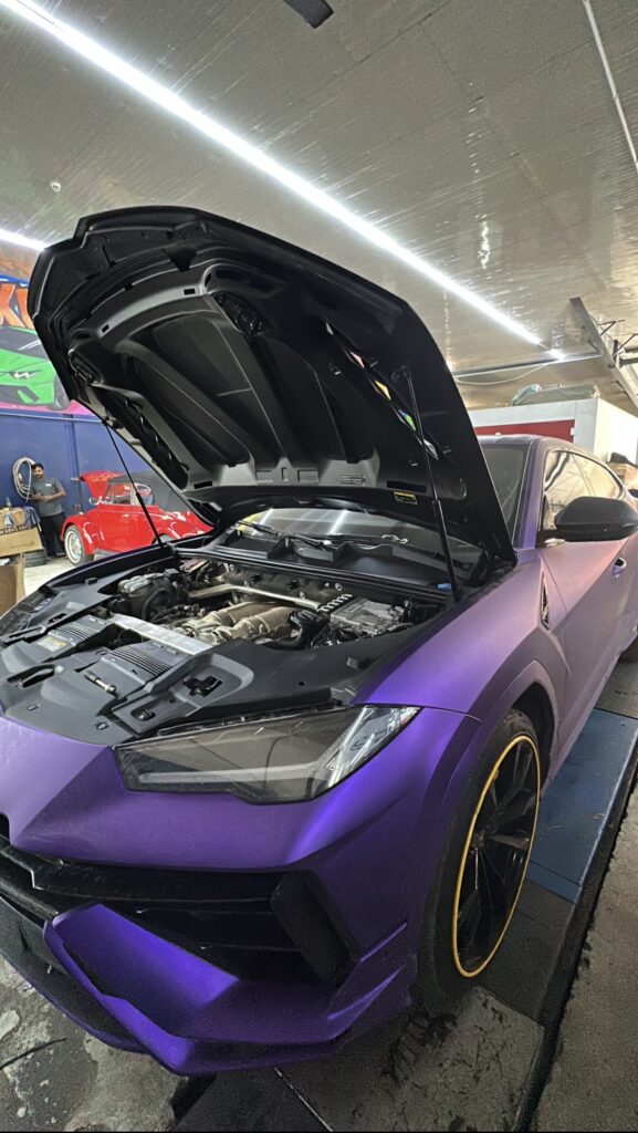 Lamborghini Urus engine bay inspection during oil and filter change service