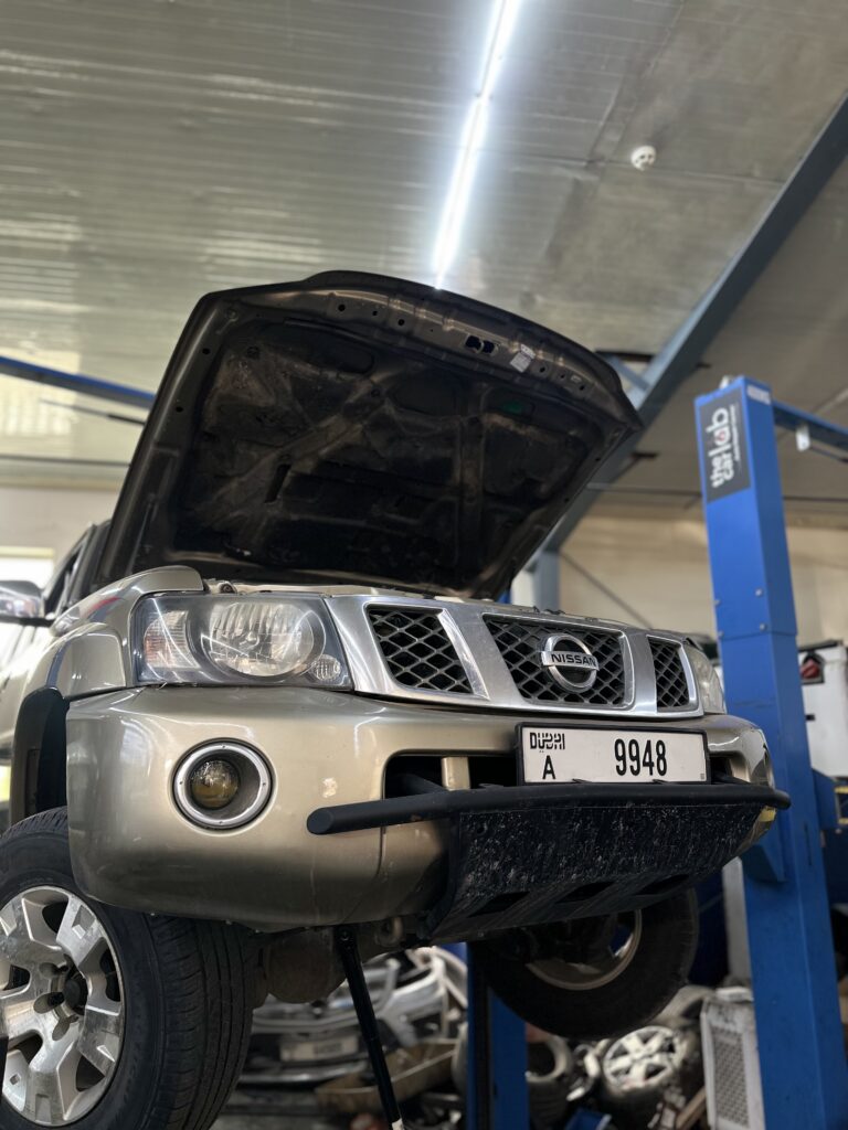 Nissan Patrol front steering shocker replace service at Dubai workshop
