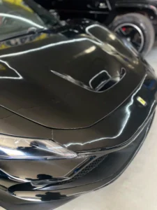 Ferrari 296 GTB repaired bonnet with flawless paint finish after accident repair in Dubai