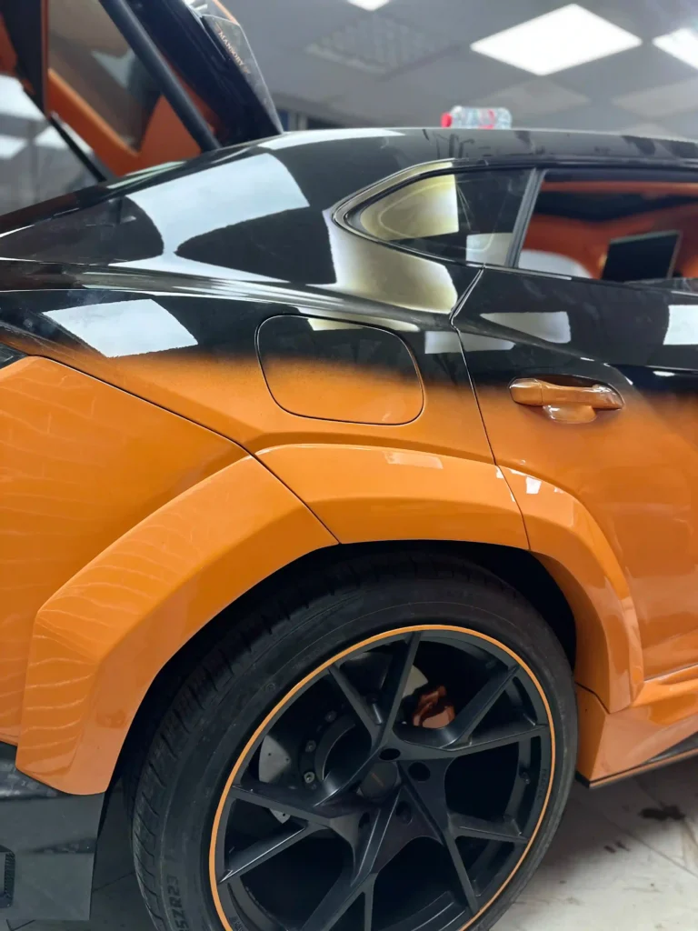 Orange and Black Lamborghini Urus Steering Repair in Dubai