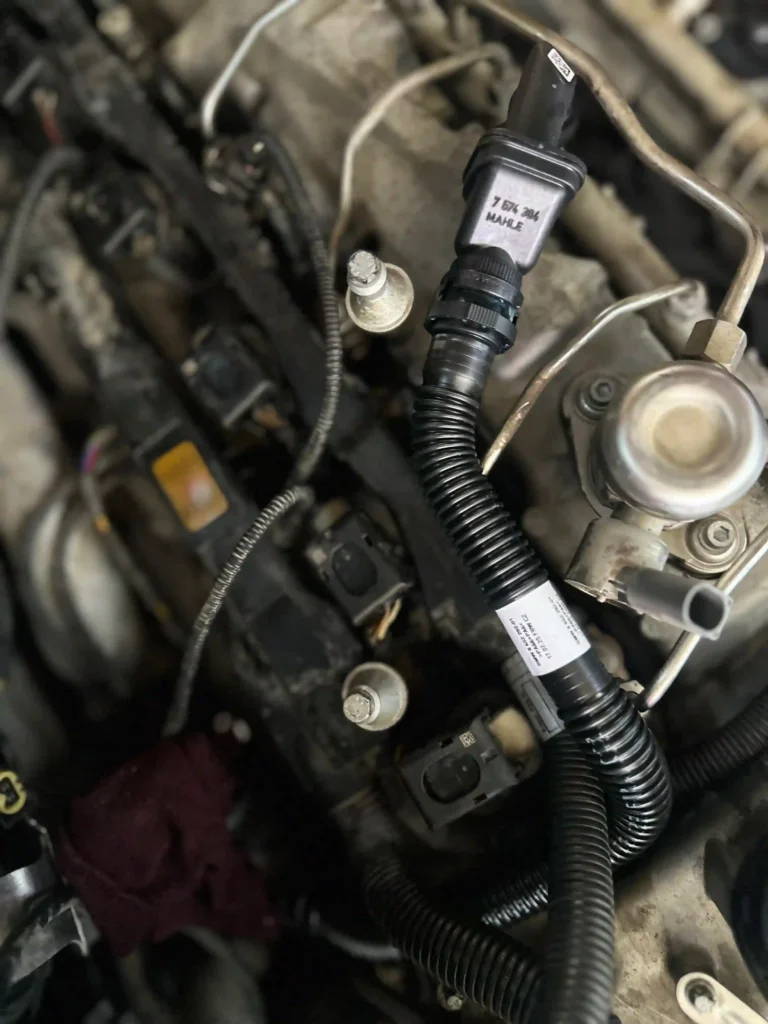 Rolls Royce Phantom ignition system inspection during spark plugs replacement service in Dubai.